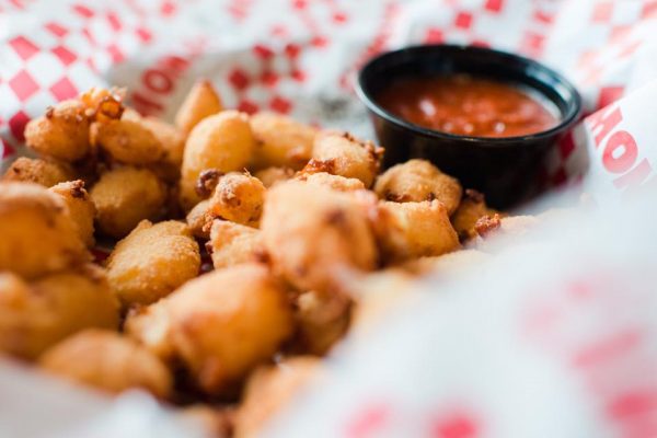 fried tater tots with dipping sauce.