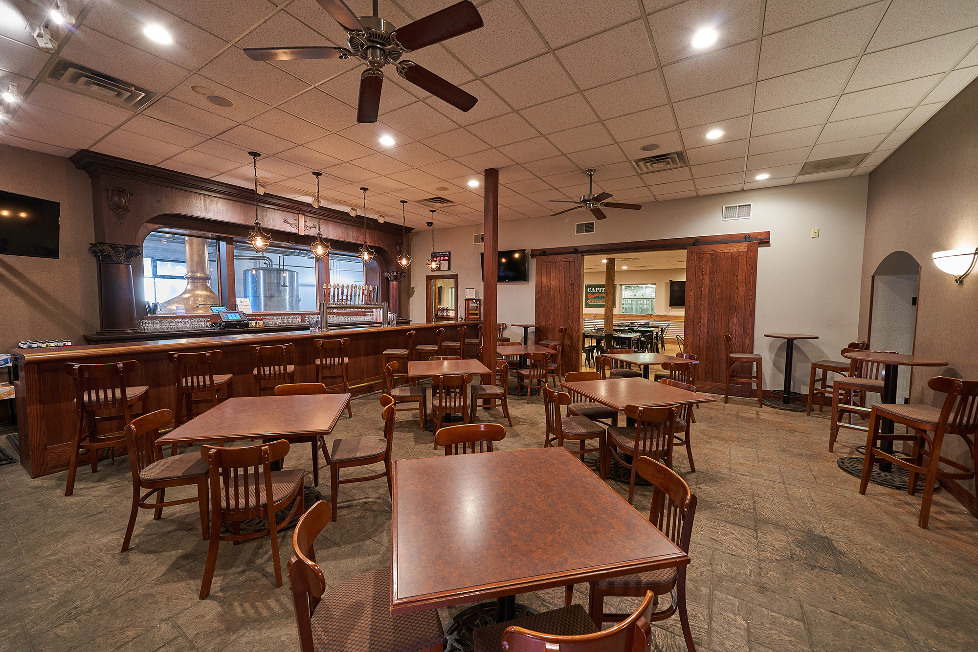 A room with tables and chairs.
