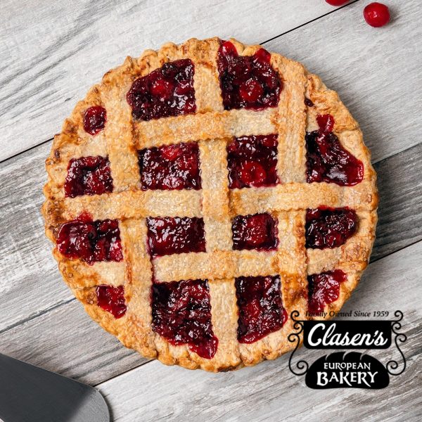 A cranberry pie on a wooden table.