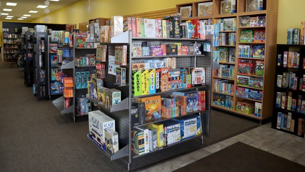 A board game store with shelves full of books.