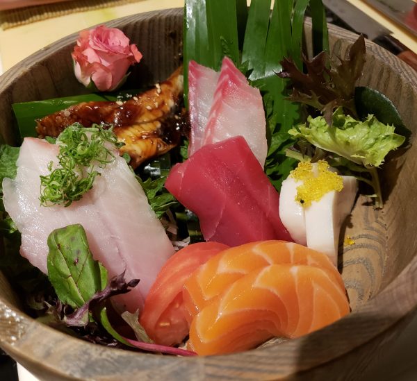 Japanese sashimi in a wooden bowl.