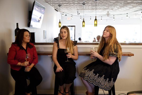 A group of women sitting in a bar.