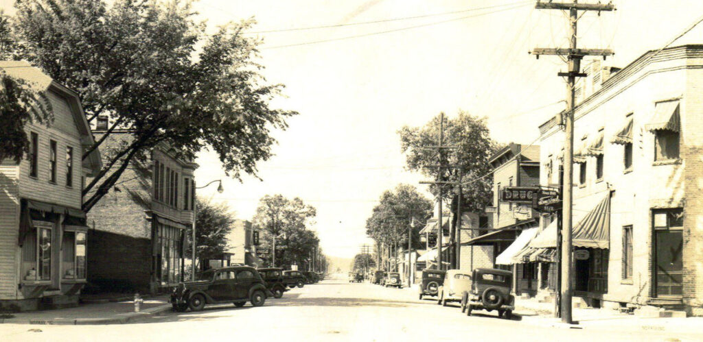 an old black and white photo of a street
