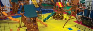 a children's play area with swings and slides