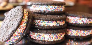 a stack of chocolate cookies with sprinkles