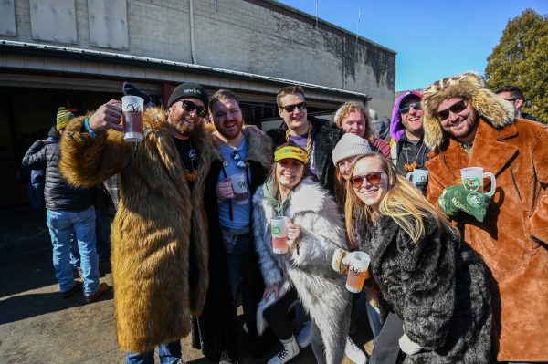 A group of people in fur coats posing for a photo at Bockfest in Middleton Wisconsin.