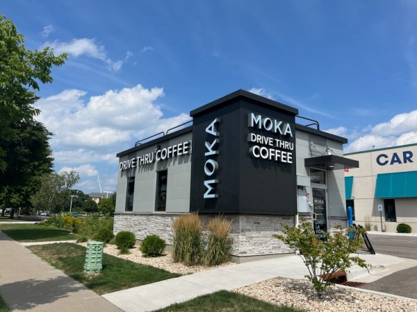 A building with a sign that says moka coffee.