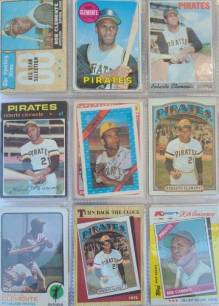 A collection of baseball cards in a clear plastic case.