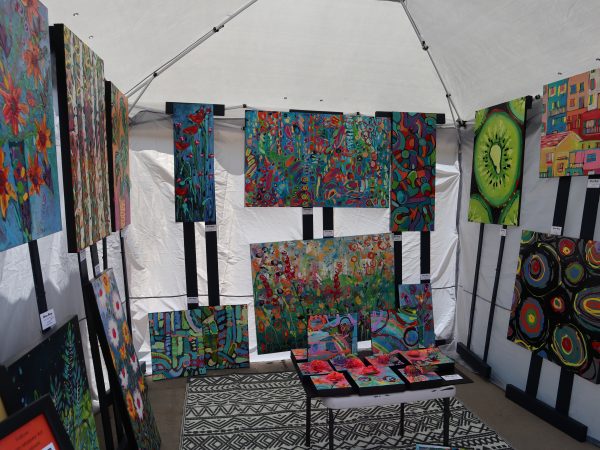 A tent with a lot of paintings on it.