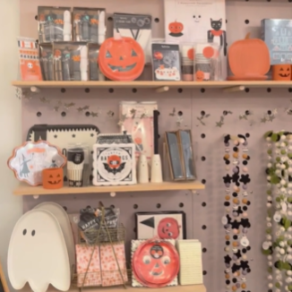 A display of Halloween items on a shelf.