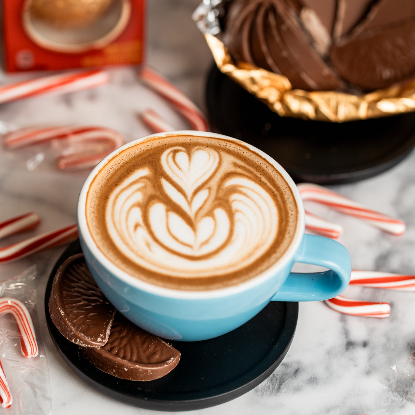 A cup of coffee with candy canes and candy canes.
