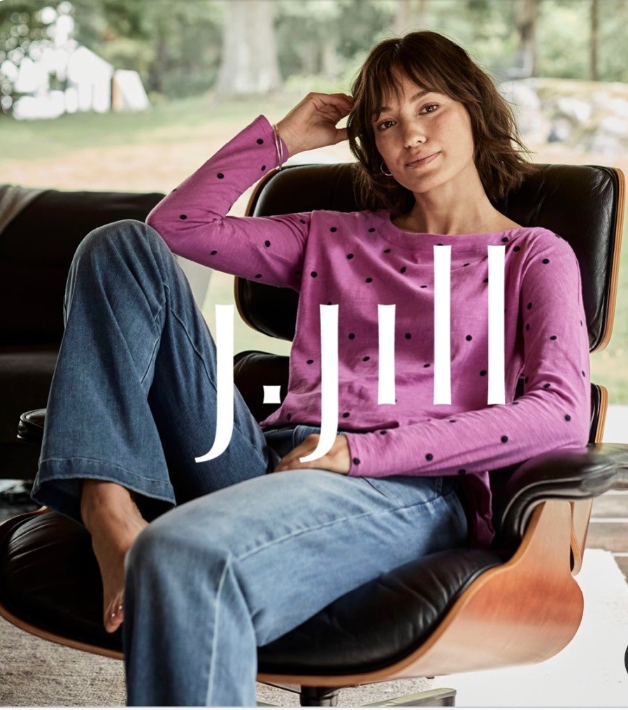 A woman sitting in a chair with the word jill on it.
