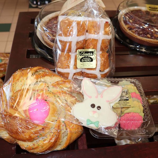 Clasen's European Bakery: hot cross buns, "egg nest"--pastry with colorful egg in the middle; and a white bunny-shaped sugar cookie.