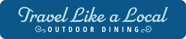 Graphic banner reading "travel like a local @ patio dining" in decorative white cursive on a navy blue background.