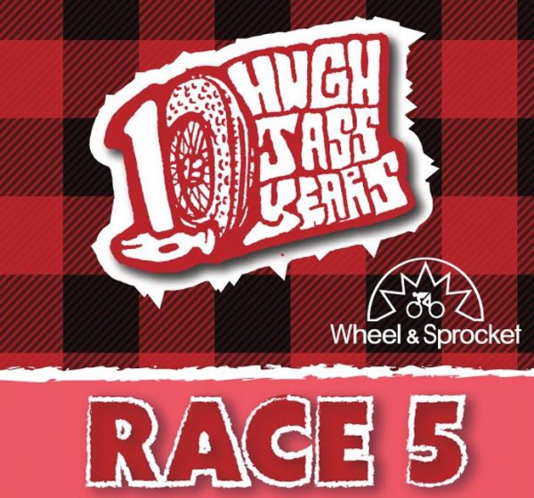 Red plaid background with white text: "10 Hugh Jass Years." Below, a bicycle logo and "Wheel & Sprocket," celebrating a decade of cycling passion. Text at the bottom reads "Race 5 Bike Race," adding an exhilarating touch to this memorable milestone.