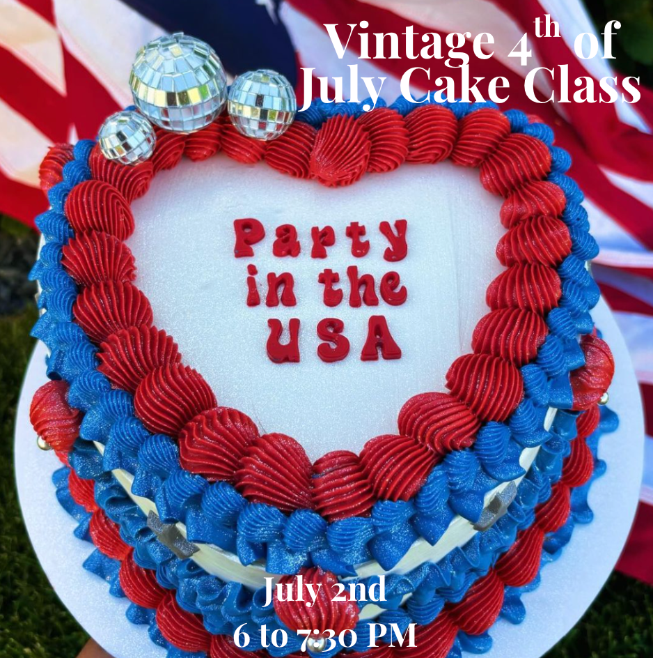 Heart-shaped cake with red and blue frosting, silver disco balls, and "Party in the USA" written on top; text advertises a Vintage 4th of July Cake Class on July 2nd, 6 to 7:30 PM.