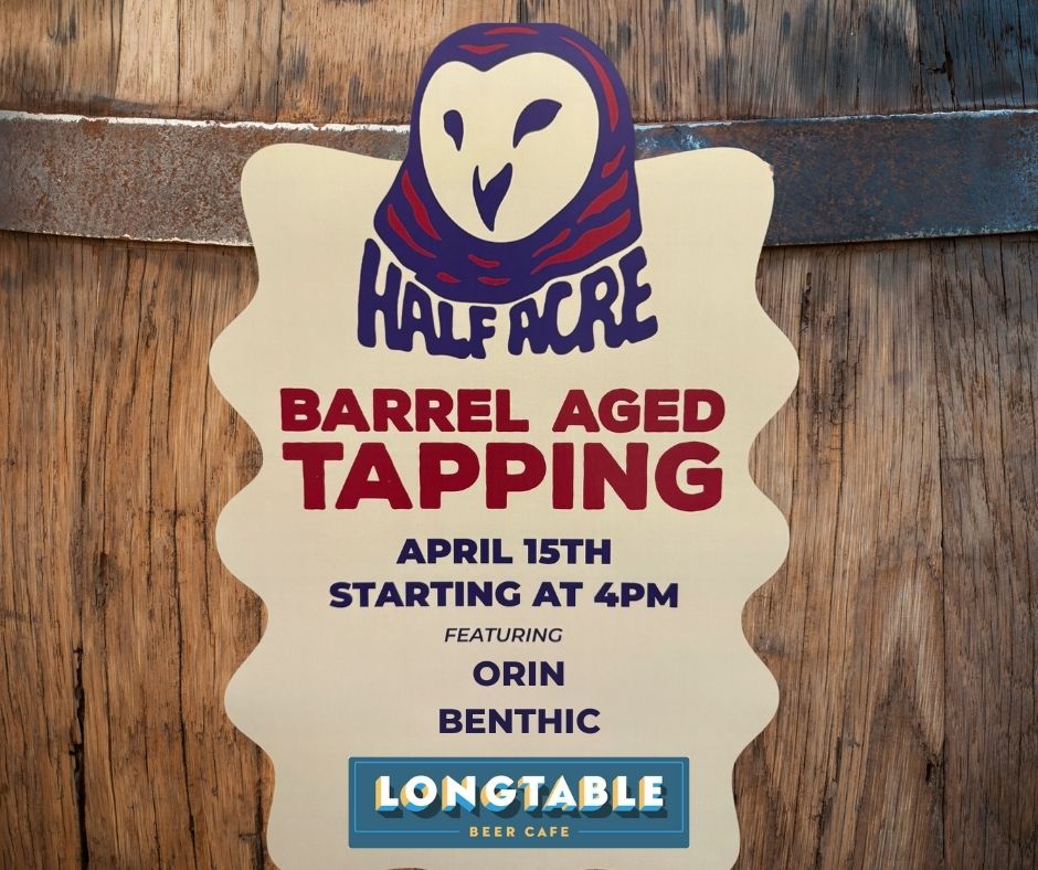 A sign for Half Acre Barrel Aged Tapping event on April 15th at 4pm featuring Orin and Benthic, hosted by Longtable Beer Cafe, is displayed in front of a barrel.