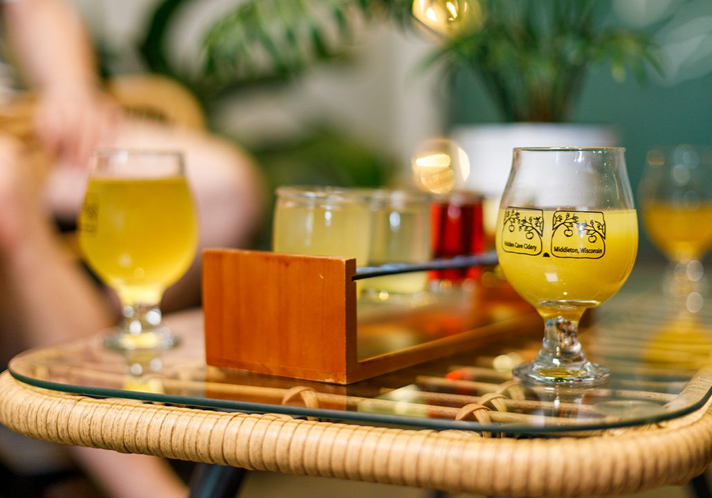 A glass of beer on a table.